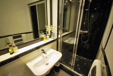 Black and white bathroom with a black shower tray.