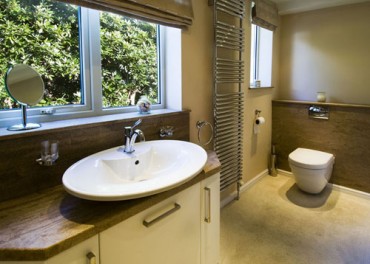 Bathroom cabinet with bespoke vanity top from Versital in granite finish 'Sandstone'.