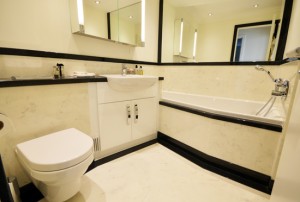 Bespoke luxury bathroom with black and white marble and granite finishes
